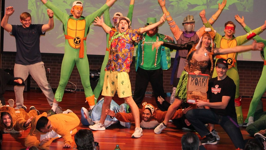 Sigma Nu Fraternity Wearing Turtle costumes in a performance