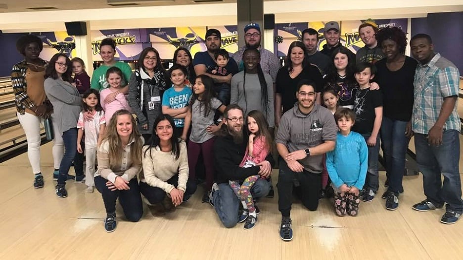 Picture of Group Of nontraditional students and their children in bowling alley event