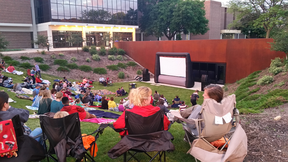 Outdoor Movie picture with lawn chairs and inflatable screen
