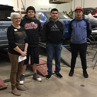 Students touring the Hennepin Technical College Auto shop