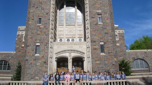 A group of ETS students posing for a picture on the campus of St. Scholastica