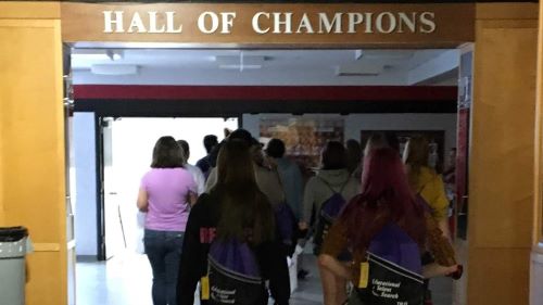 A group of student in the hall of champions of the college st. cloud 