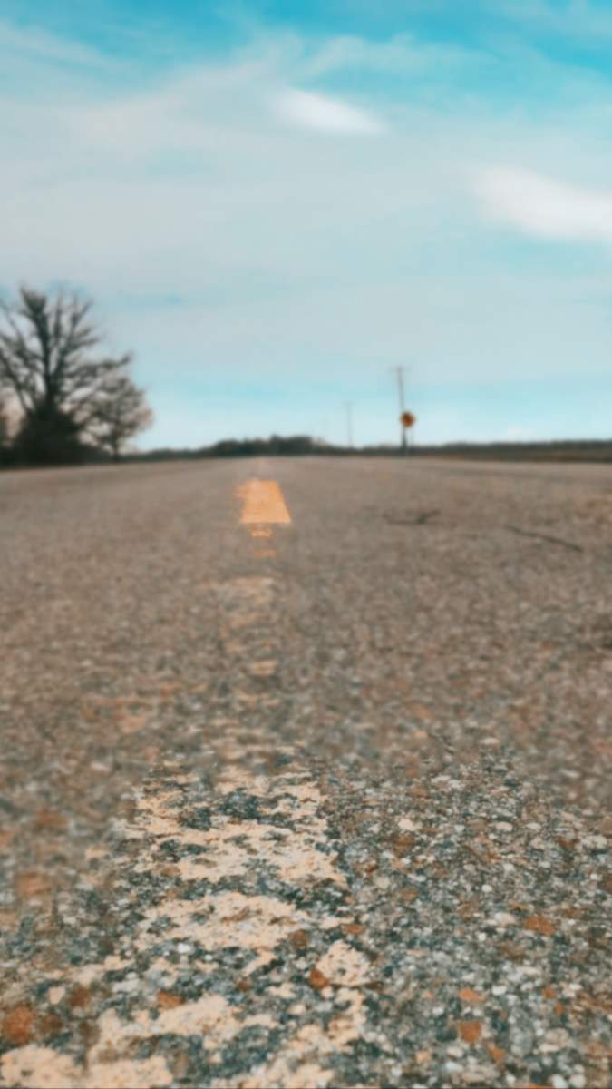 a road with a yellow line