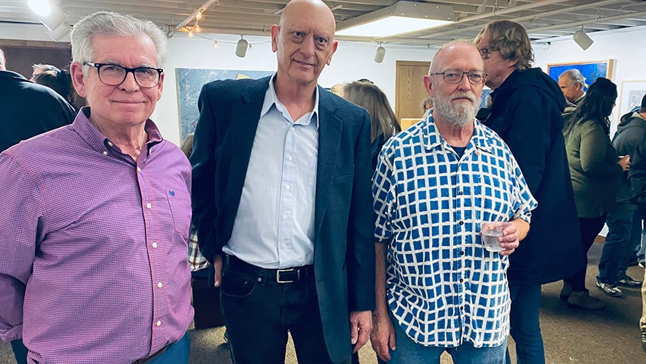 Minnesota State Mankato art alums, Charlie Putnam, Mark McLaughlin and Jeffrey Flagg Johnson, posing together during their joint exhibition at the Arts Center of Saint Peter