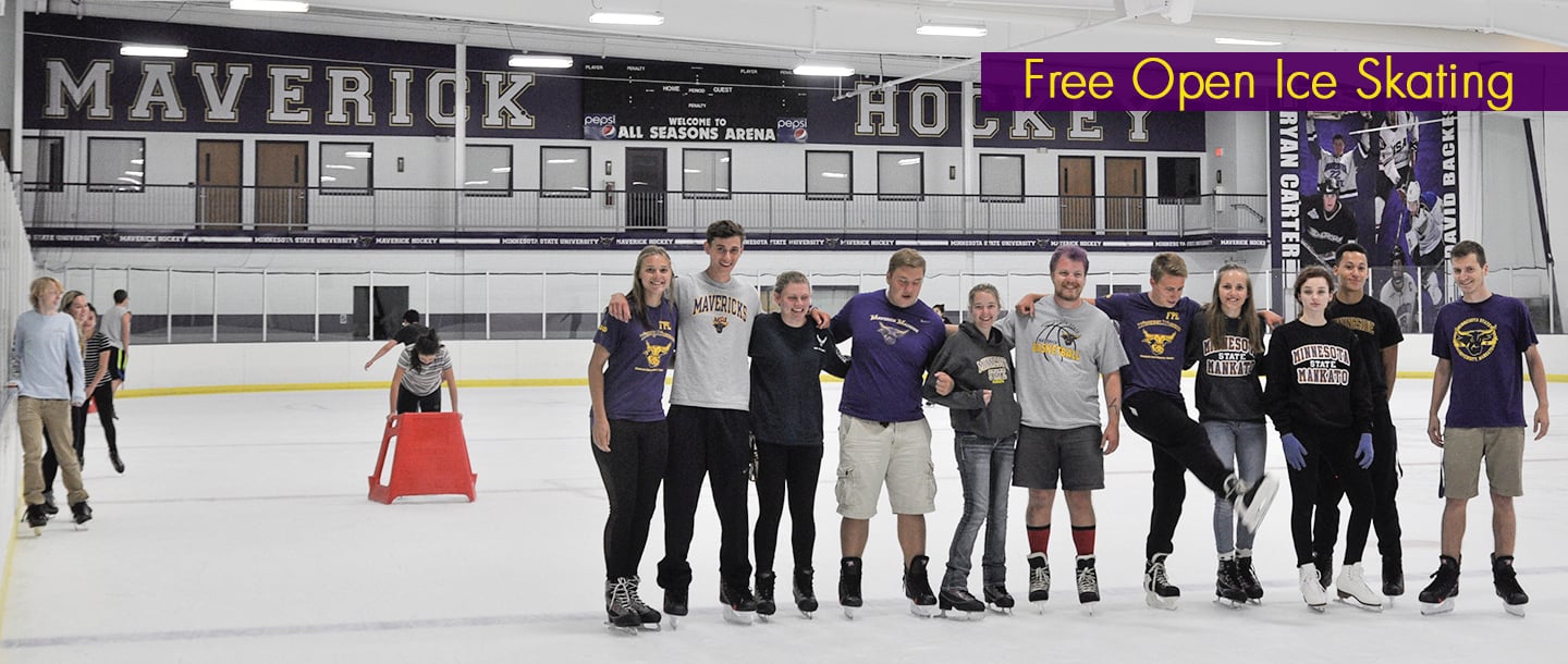 Students posing on the ice at the All Seasons Arena for free open ice skating day