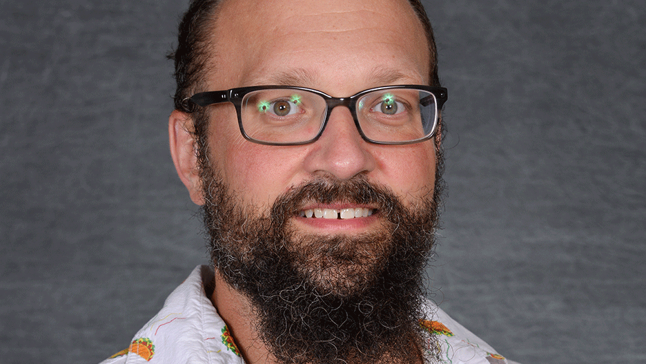 a person with a beard and glasses