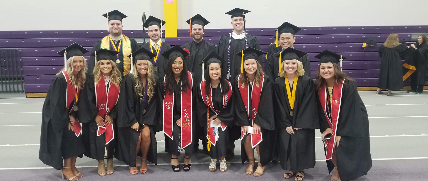 Picture of fraternity and sorority members posing in formal