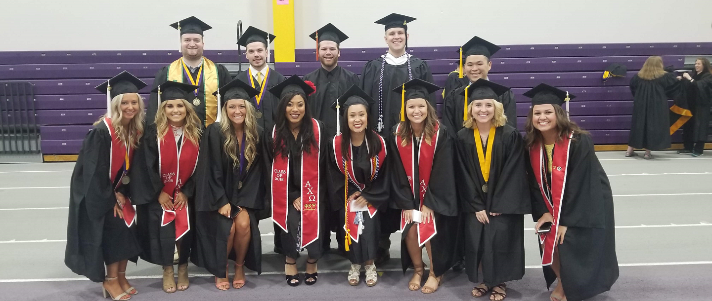 Picture of fraternity and sorority members posing in formal 