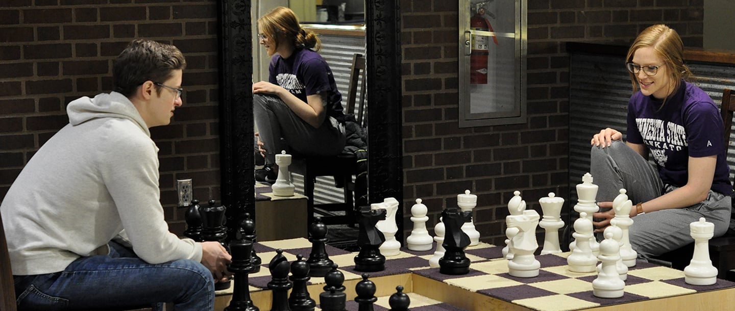 Two students playing the Giant Chess on Bullpen