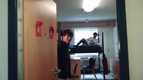 Two international students posing inside their dorm as they experience campus life