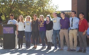 Members of the Homecoming Royalty Court of 2016 posing for a photo outside on campus