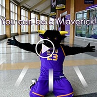 Stomper on his knees holding is hands out with the quote "you can be a Maverick"