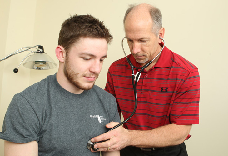 Student being examined by doctor at health service