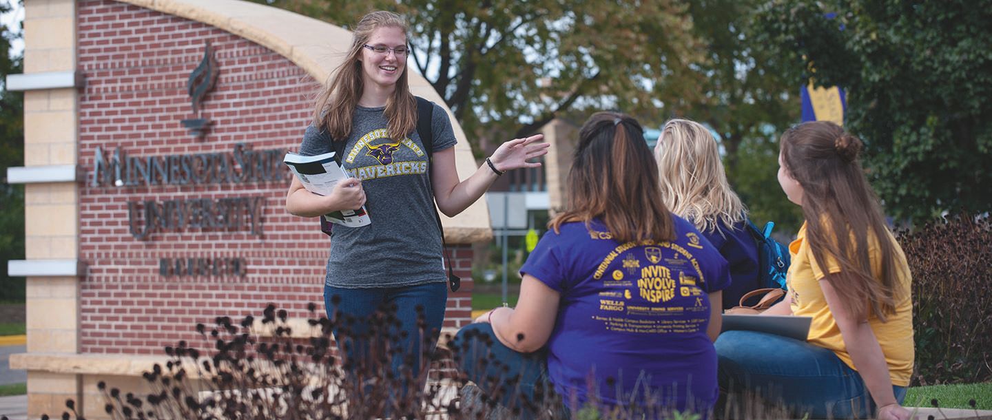 Four female students studying outside