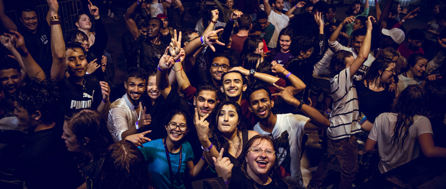 Students dancing and posing at the foam party