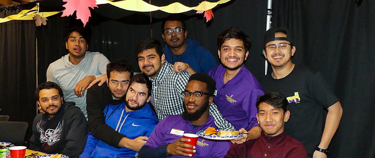 Ops team members posing for a group photo at an event