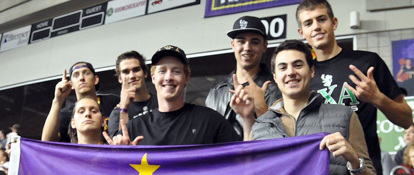 students posing for picture with a Minnesota State University banner