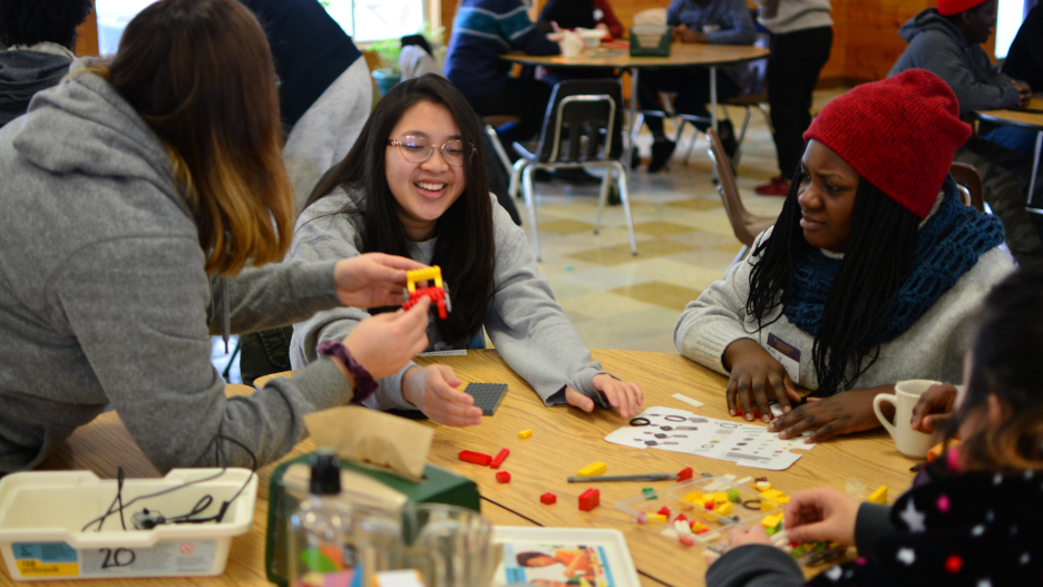 group of students are playing lego at retreat