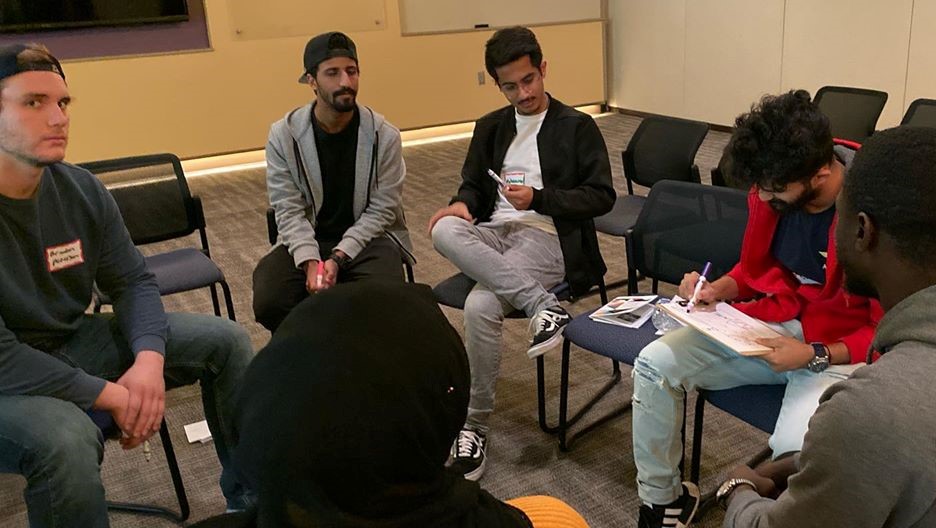 a group of students are having discussion in youth lead session