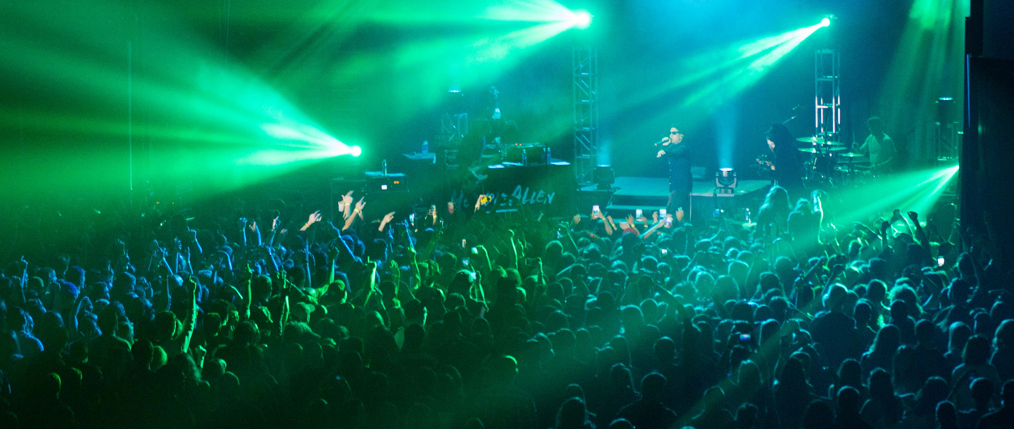 Picture of Concert Crowd with Green lighting from top