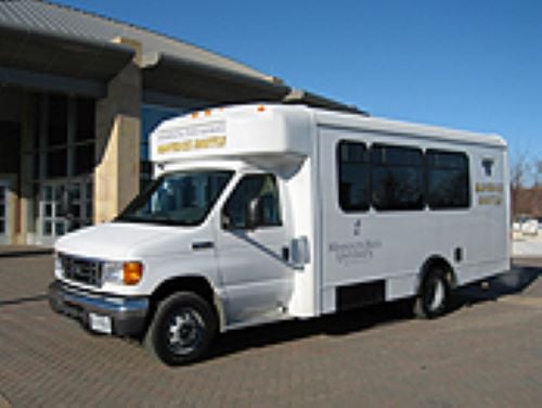 The Maverick shuttle parked outside of the Centennial Student Union