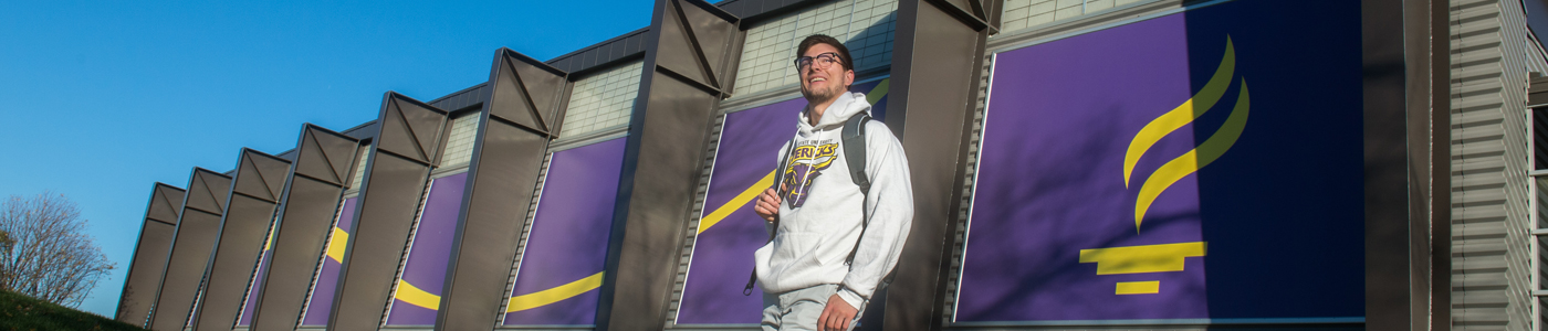 a person wearing glasses and a backpack