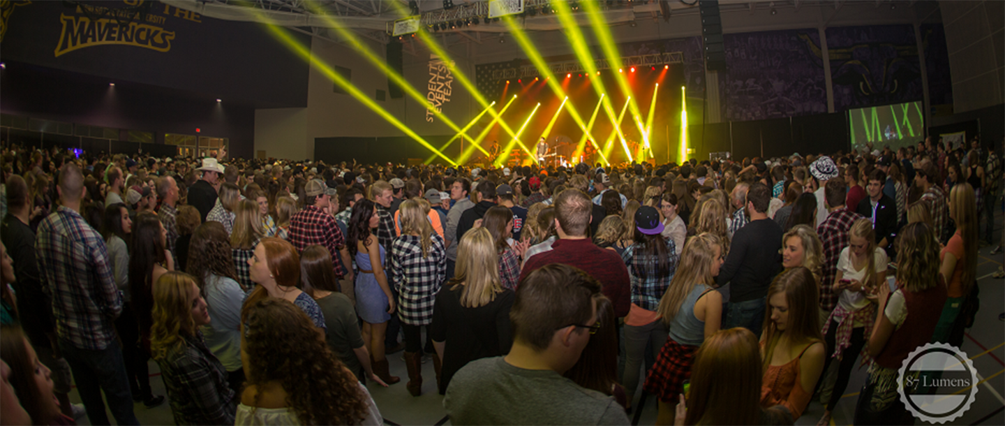The audience at a concert on campus in the Myers Field House