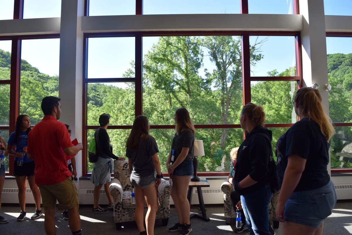 Students looking out of the window of University of Wisconsin- Eau Claire