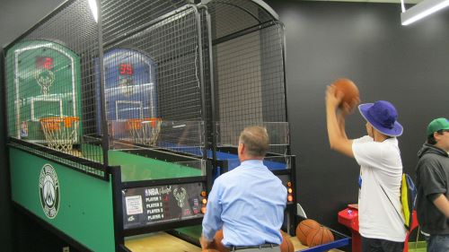 Two people shooting  basketball
