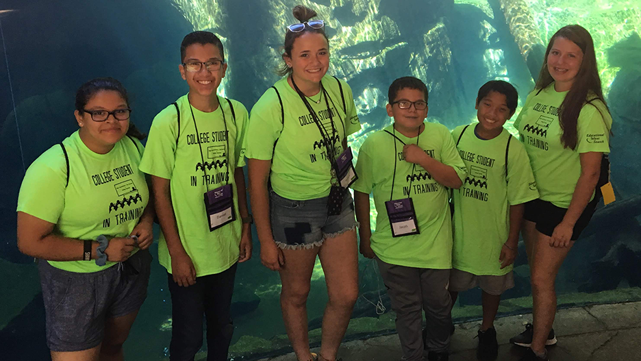 ETS students posing by the aquarium at the Minnesota Zoo