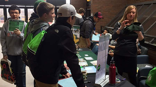 ETS students talking to someone at a vendor table during TRIO Day 2018