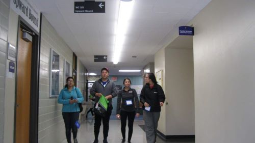 ETS students walking in the hallway outside the Upward Bound office
