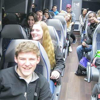 ETS students travelling  in a charter bus