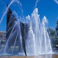 The sculpture and the fountain located outside on the mall between the Centennial Student Union and Memorial Library