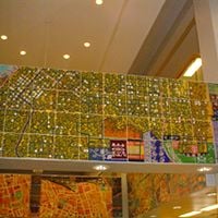 The Around the World on the 44th Parallel is composed of foot-square ceramic tiles that depicts cities located near the 44th parallel around the globe and is installed in Memorial Library