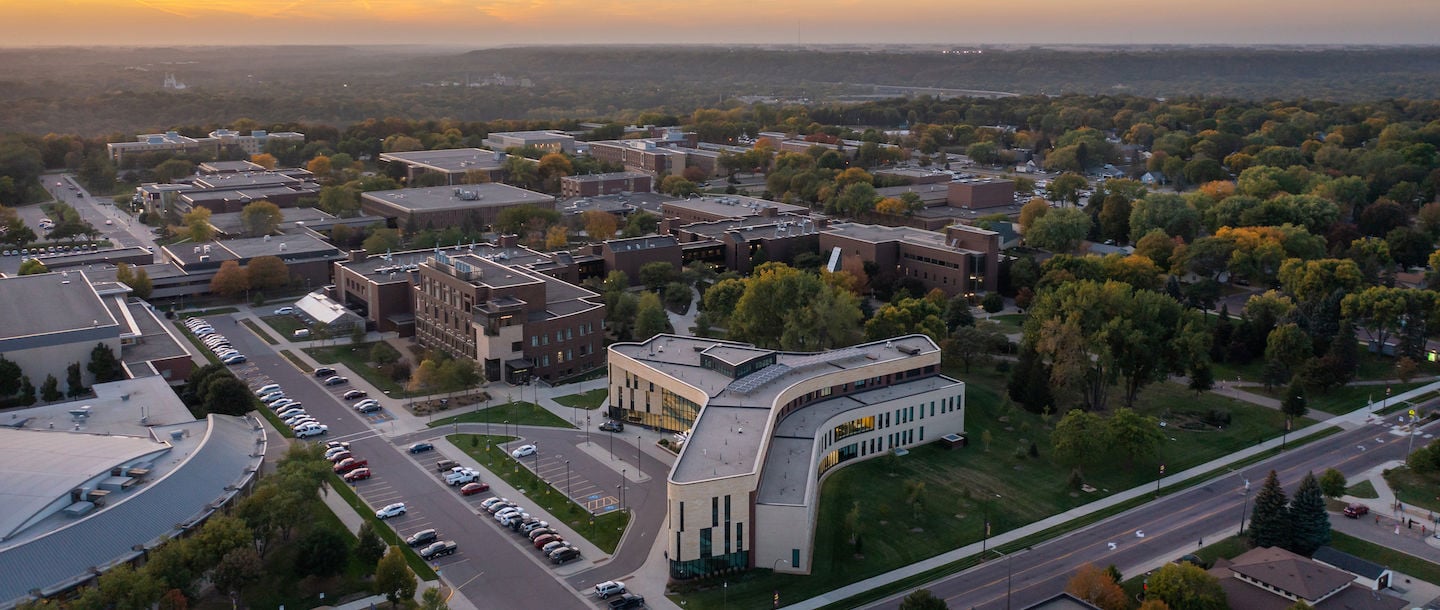 An aerial view of Minnesota State Mankato Clinical Science building, Ford Hall and Trafton on a summer evening as the sun is setting