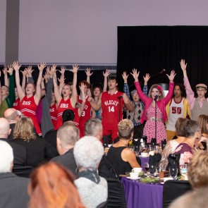 theatre department performs selections from "high school musical" for the audience at the annual purple and gold gala