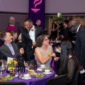 Purple and Gold Society members socializing at the Purple and Gold Gala event
