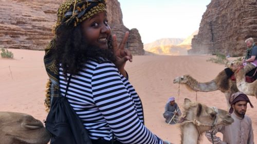Dunia Tesfaye exploring Amman, Jordan on a camel ride tour