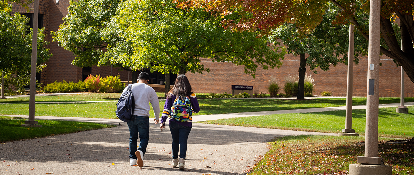 Two international students walking outside towards the Trafton Science Center