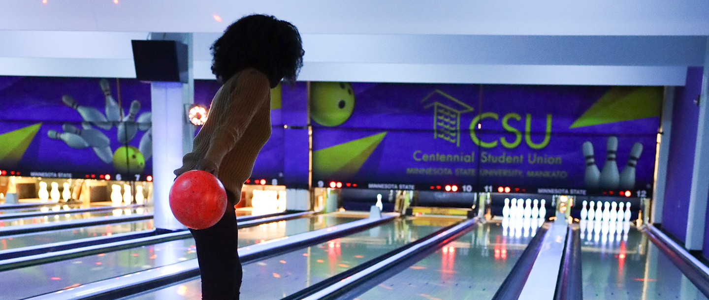 International student bowling at the Maverick Bullpen in the lower level of the Centennial Student Union