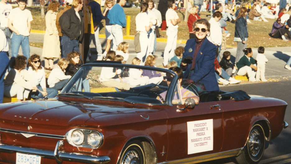 a person in a convertible car