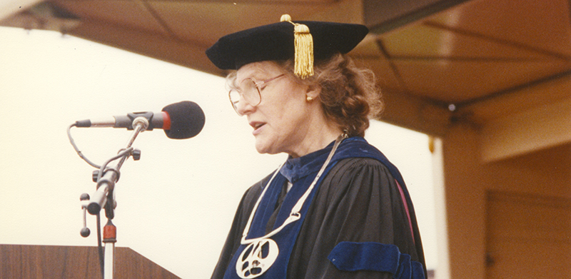 a person wearing a graduation cap and gown