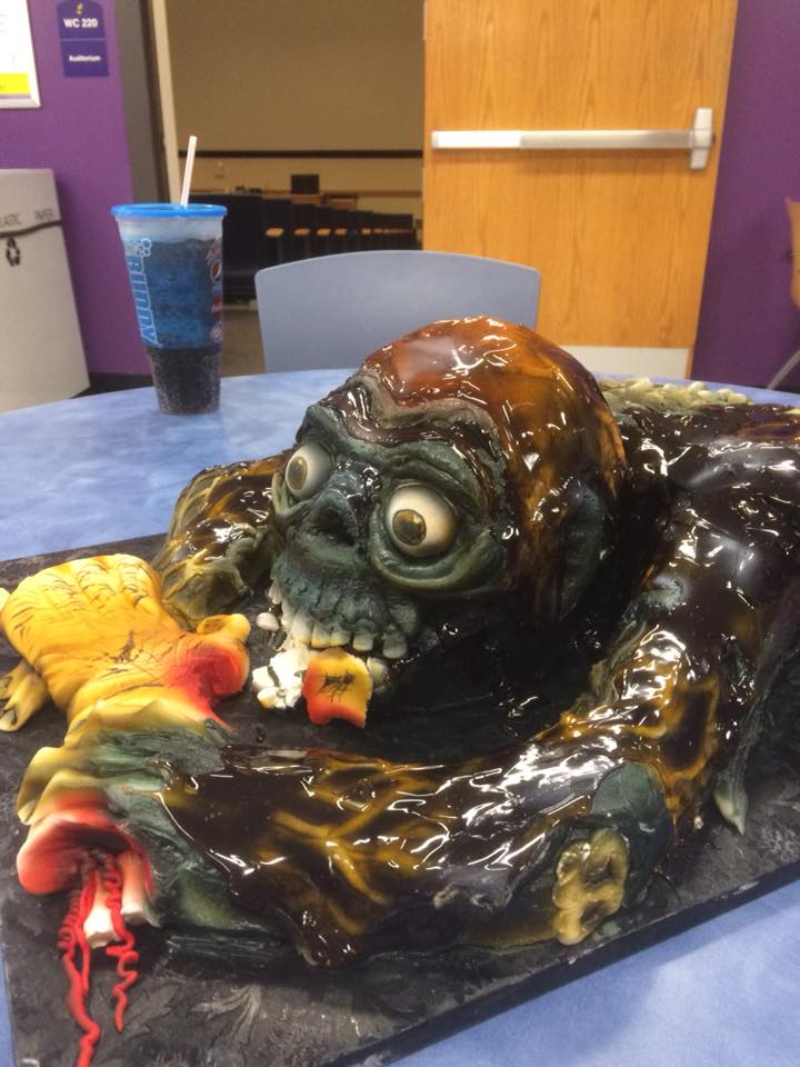 a cake shaped like a zombie