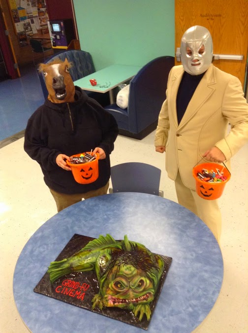 two people in clothing holding buckets of candy