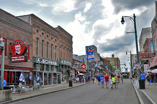 a group of people walking on a street