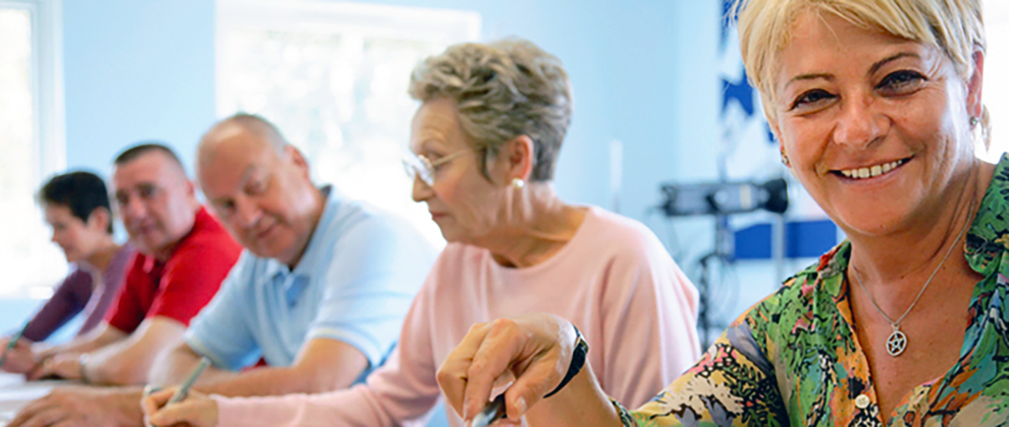 Lifelong learner members sitting at a classroom table