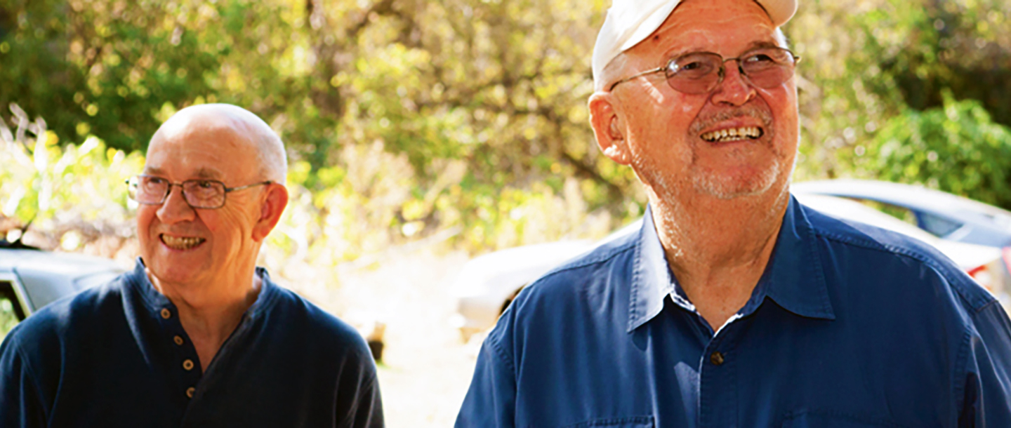 Two Lifelong Learner members outside walking to an event