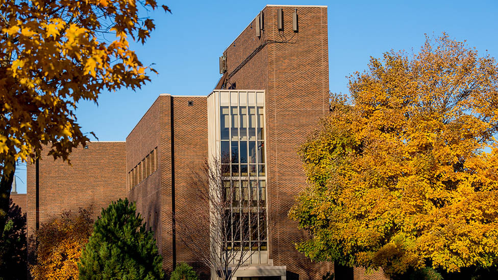 outside view of Trafton Hall with fall foliage