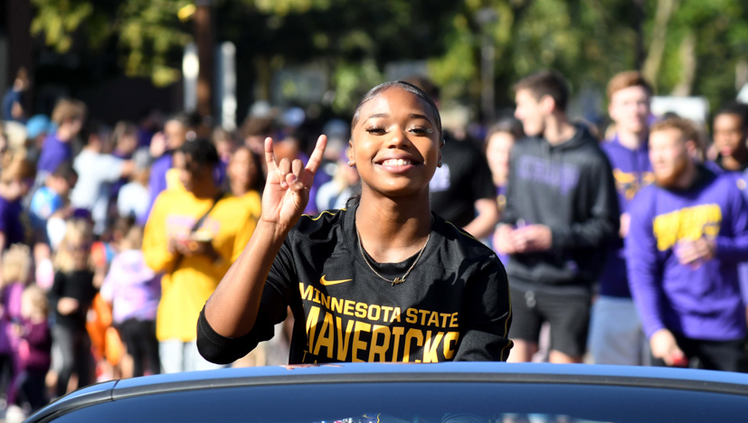 a person holding up a peace sign